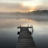 Short Dock Cottages. Teal cottage hero with the gold dock headline.